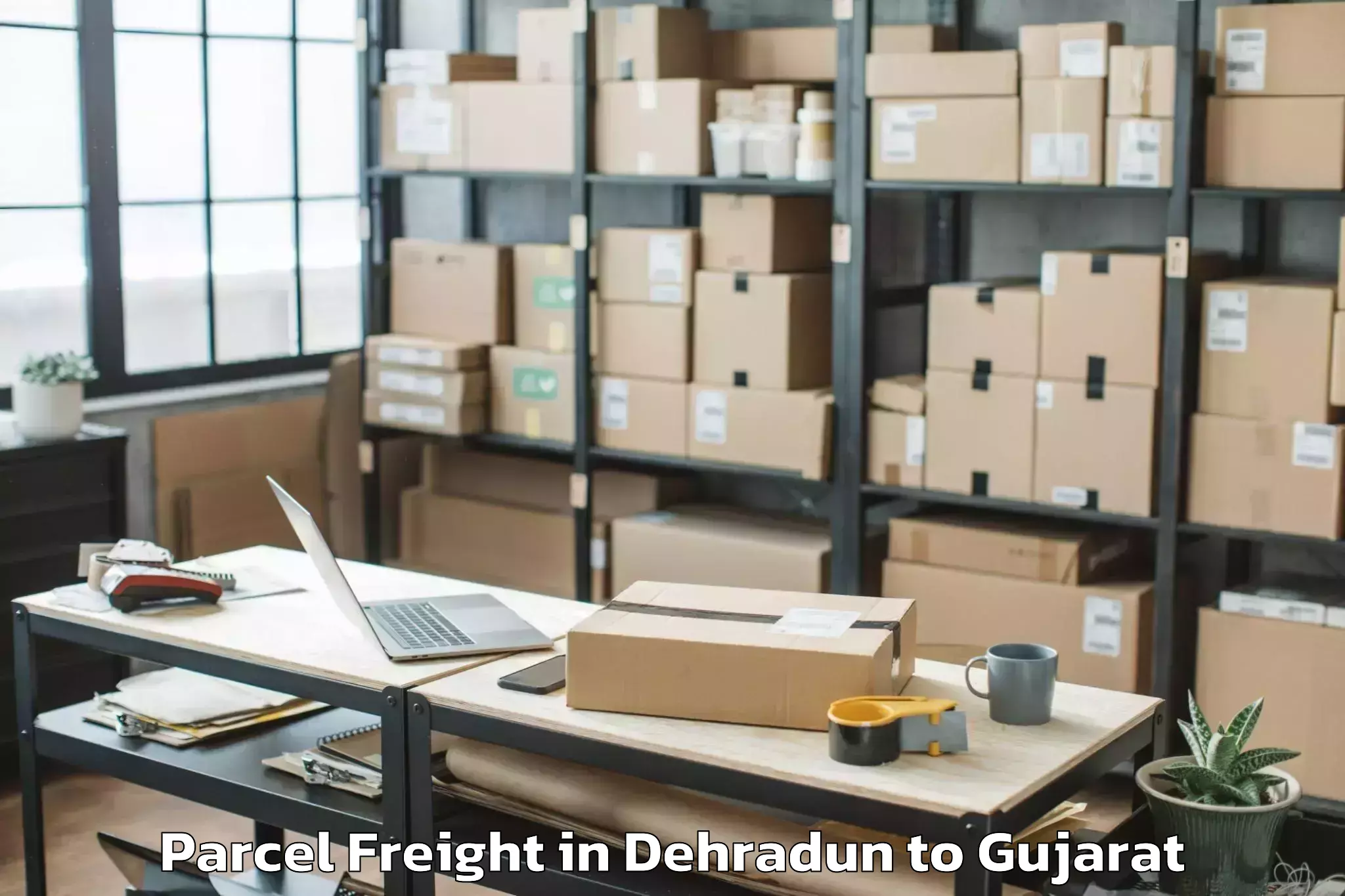 Book Dehradun to Kundla Parcel Freight